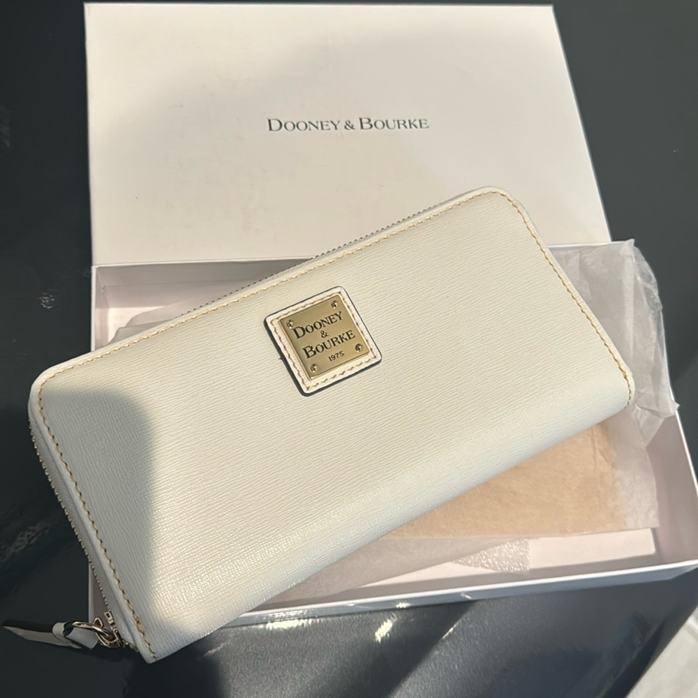 Dooney & Bourke white zip around wallet with red interior.  New with box.